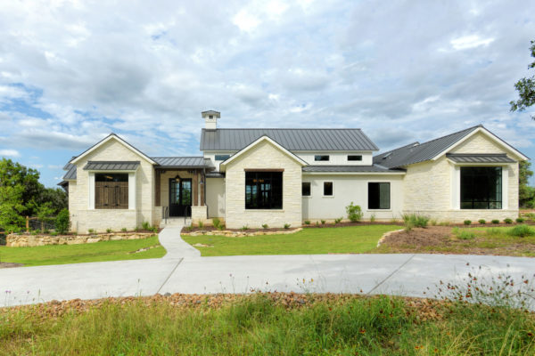 Front Elevation Picture of White Limestone House with Black Roof