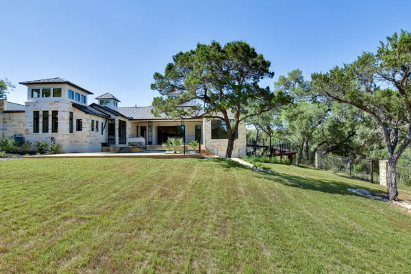 Back Elevation View of Mixed Texas Limestone House in Cordillera Ranch