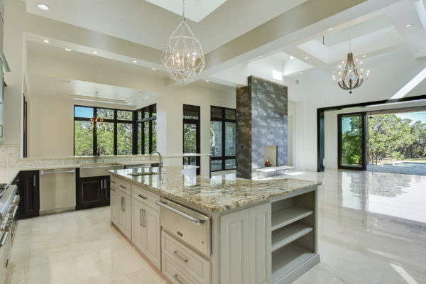 Marbled Countertop Island in Bright White Kitchen of Cordillera Ranch House