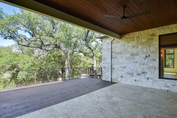 Wooden Back Porch of Mixed Limestone House in Cordillera Ranch